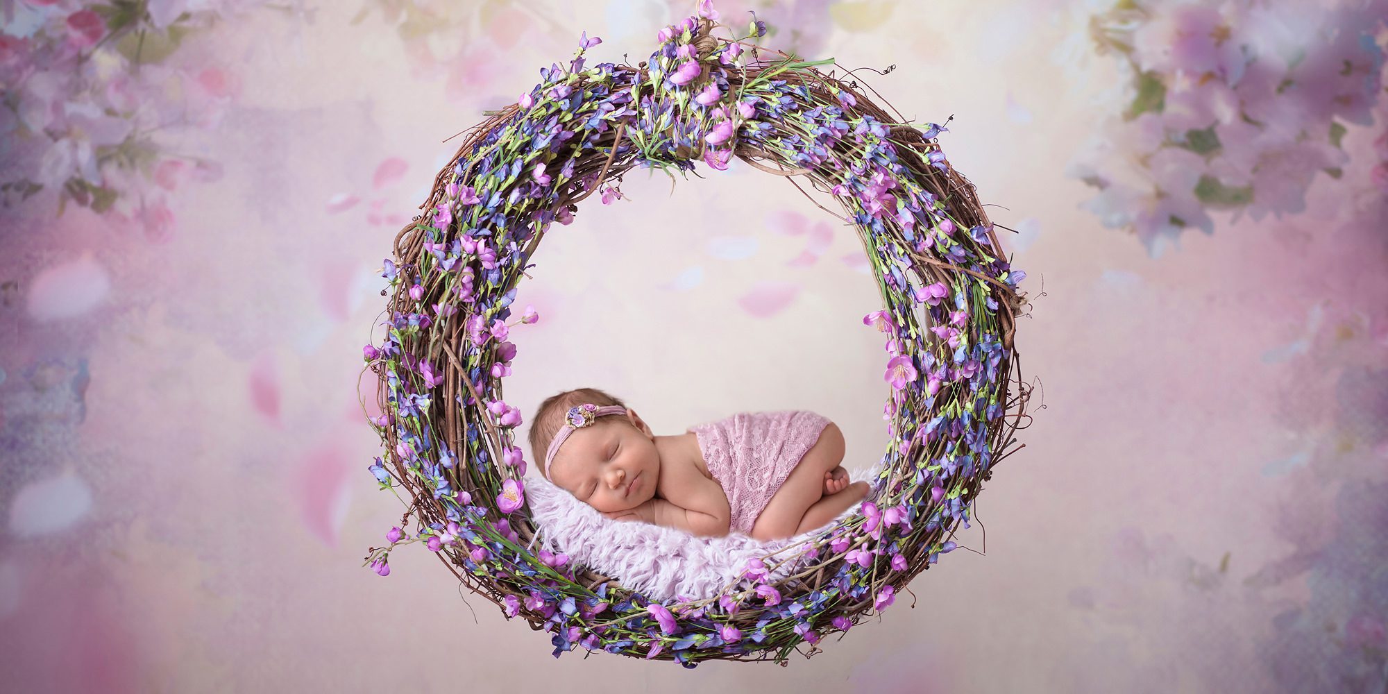 Newborn Baby girl in purple flowers