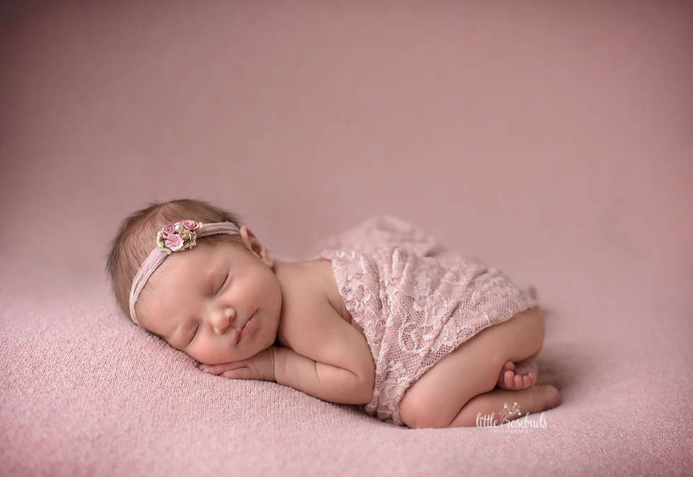 Newborn girl in lace pink