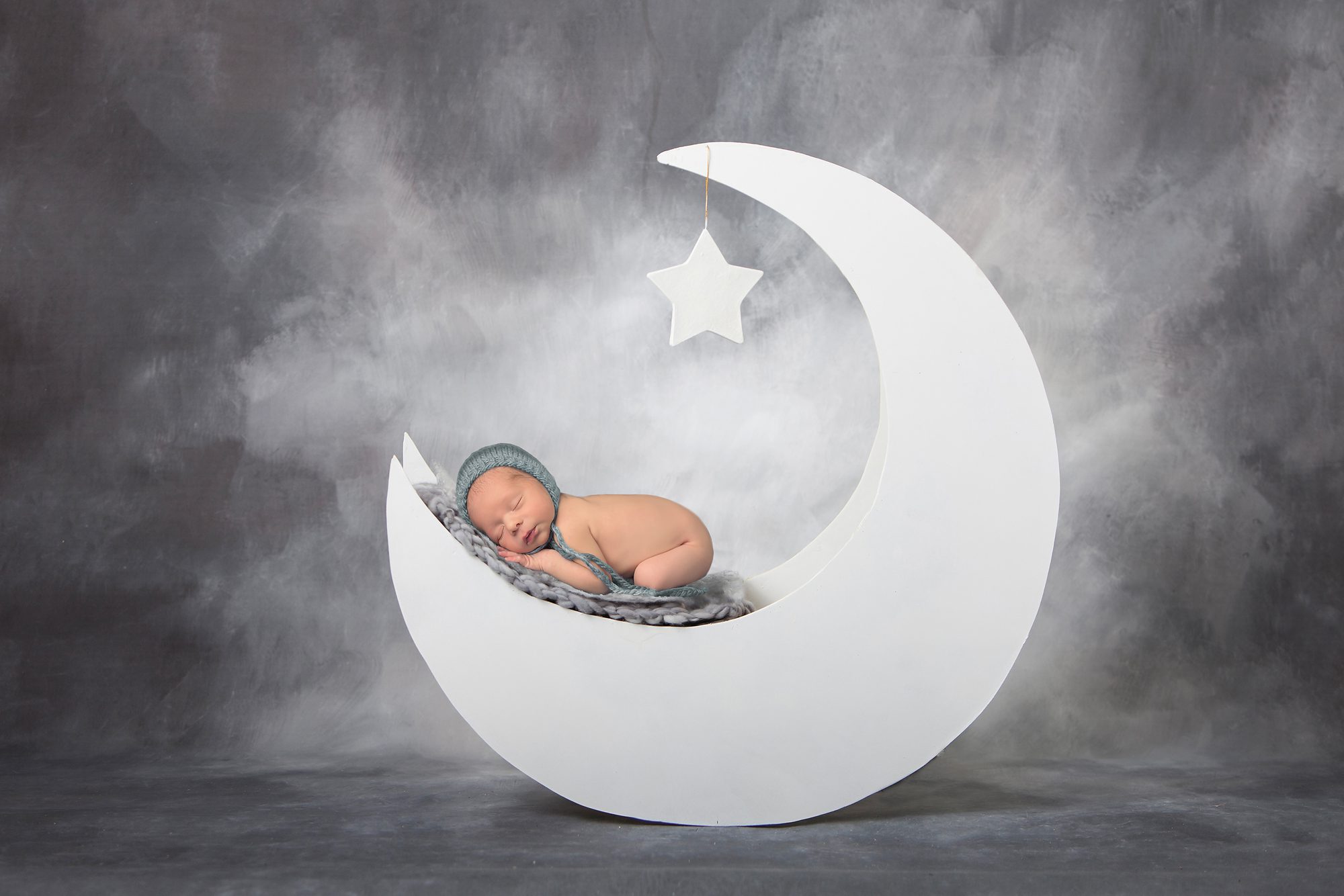newborn boy and moon