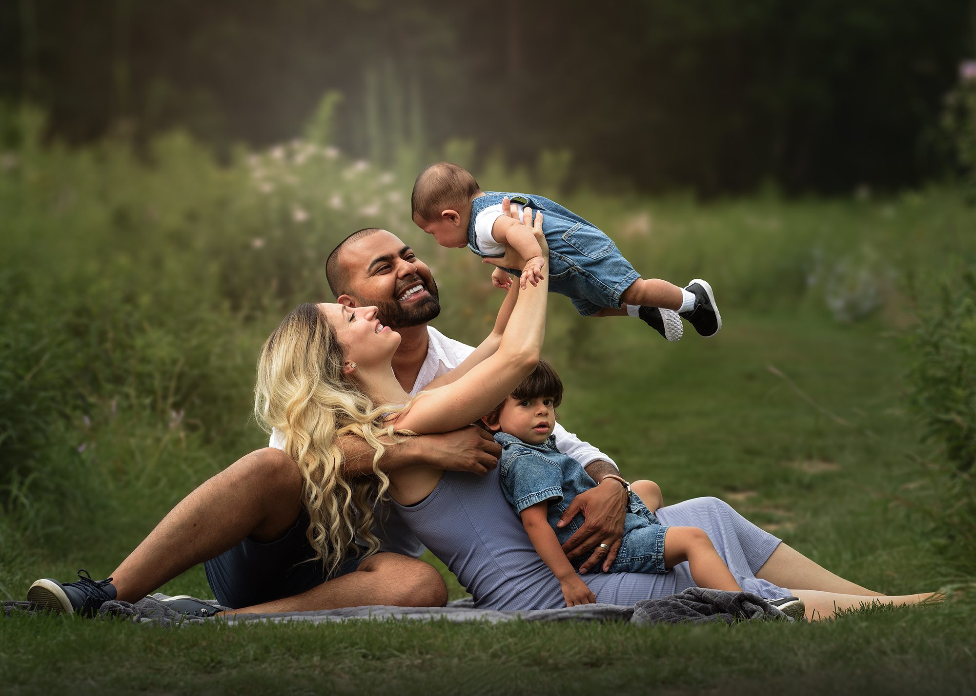 Family on the grass during an outdoor family session in Mississauga