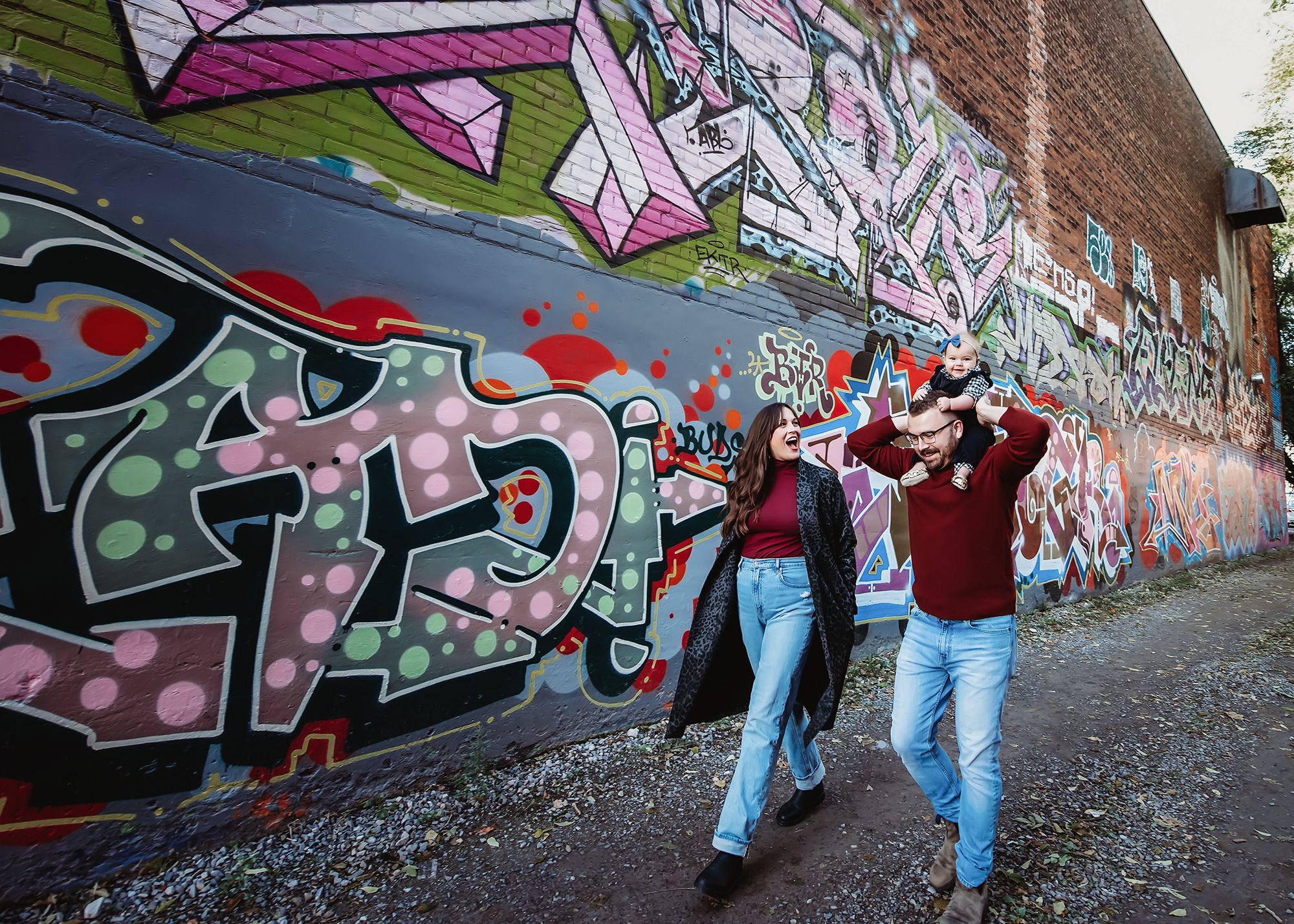 Parents and their baby in downtown hamilton graffiti photo session